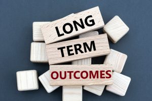 Long,Term,Outcomes, ,Words,On,Wooden,Bars,On,Cubes